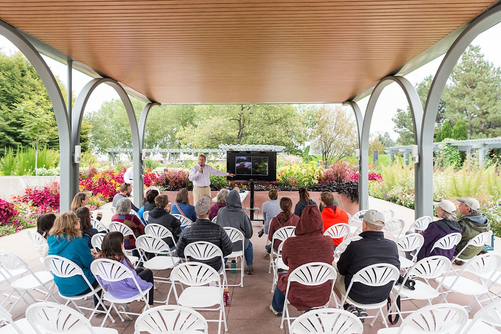People seated under the pavilion