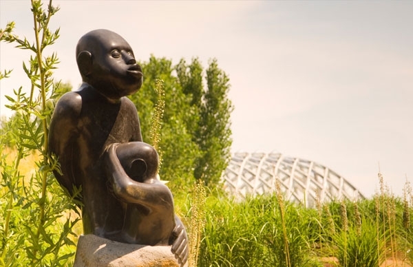 stone statue near plants