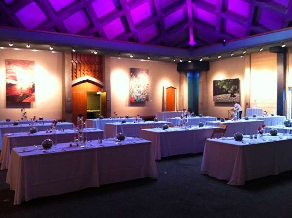 Tables set up with purple lighting