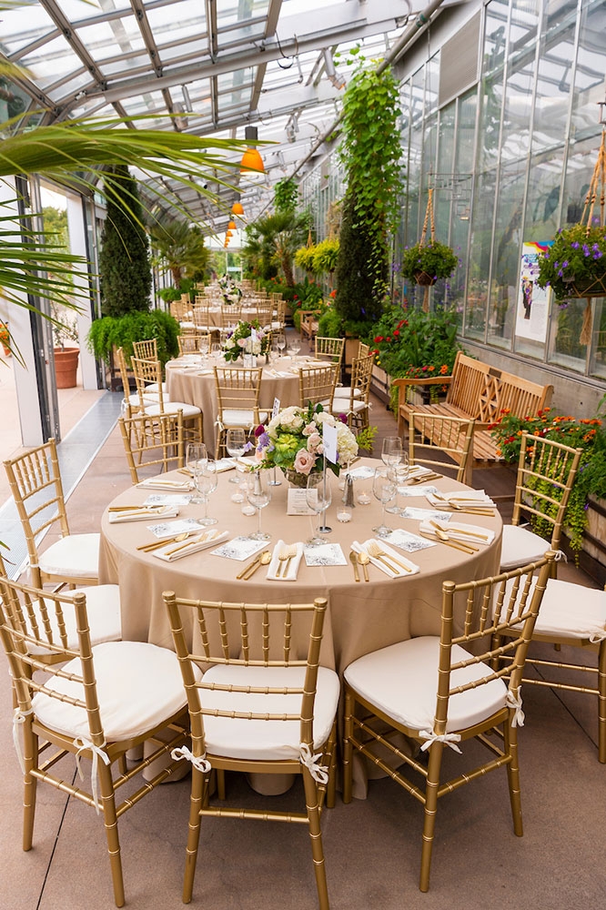 Round tables set up in the orangery