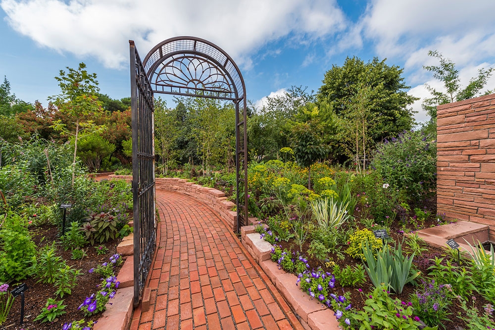 A gated pathway in the romantic gardens
