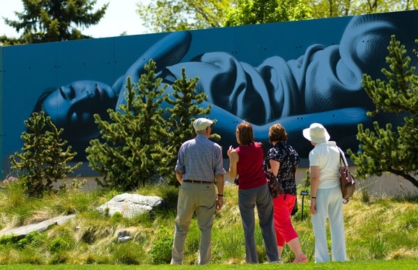 painting on wall behind trees