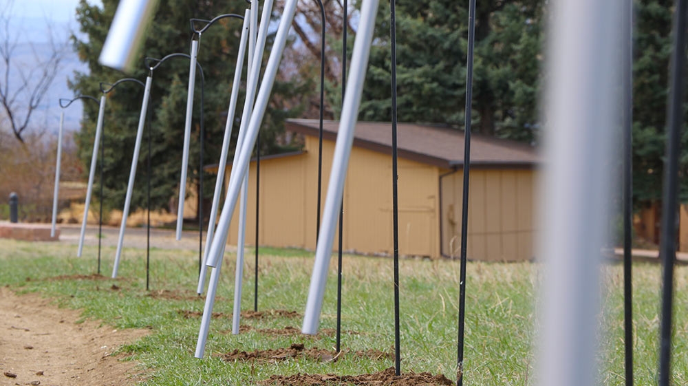 Nathan Hall, "Chime Walk II," 11 tuned windchimes and welded shepherds’ hooks and cables, 2021. Photo courtesy of Arvada Parks and Recreation.