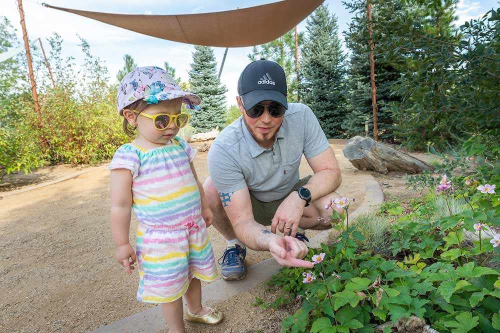 Adult and toddler in the Children's Garden