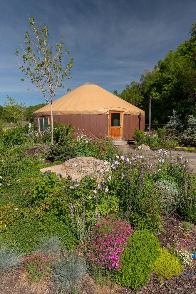 yurt with flowers in foreground