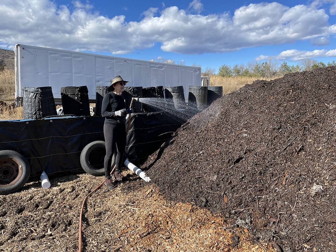 Watering compost pile
