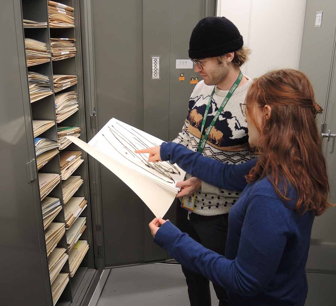 Research staff viewing a specimen in the Kathryn Kalmbach Herbarium of Vascular Plants