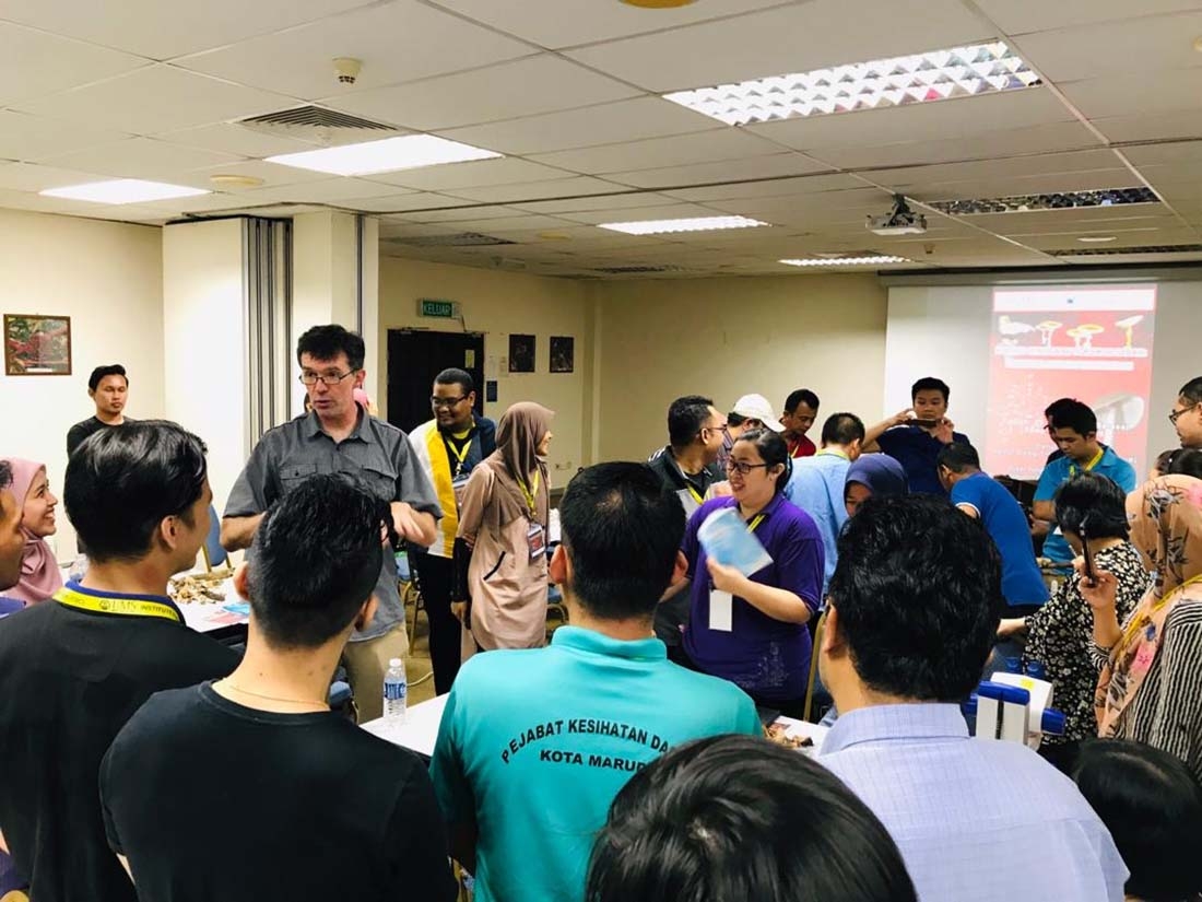 man in classroom speaking to group