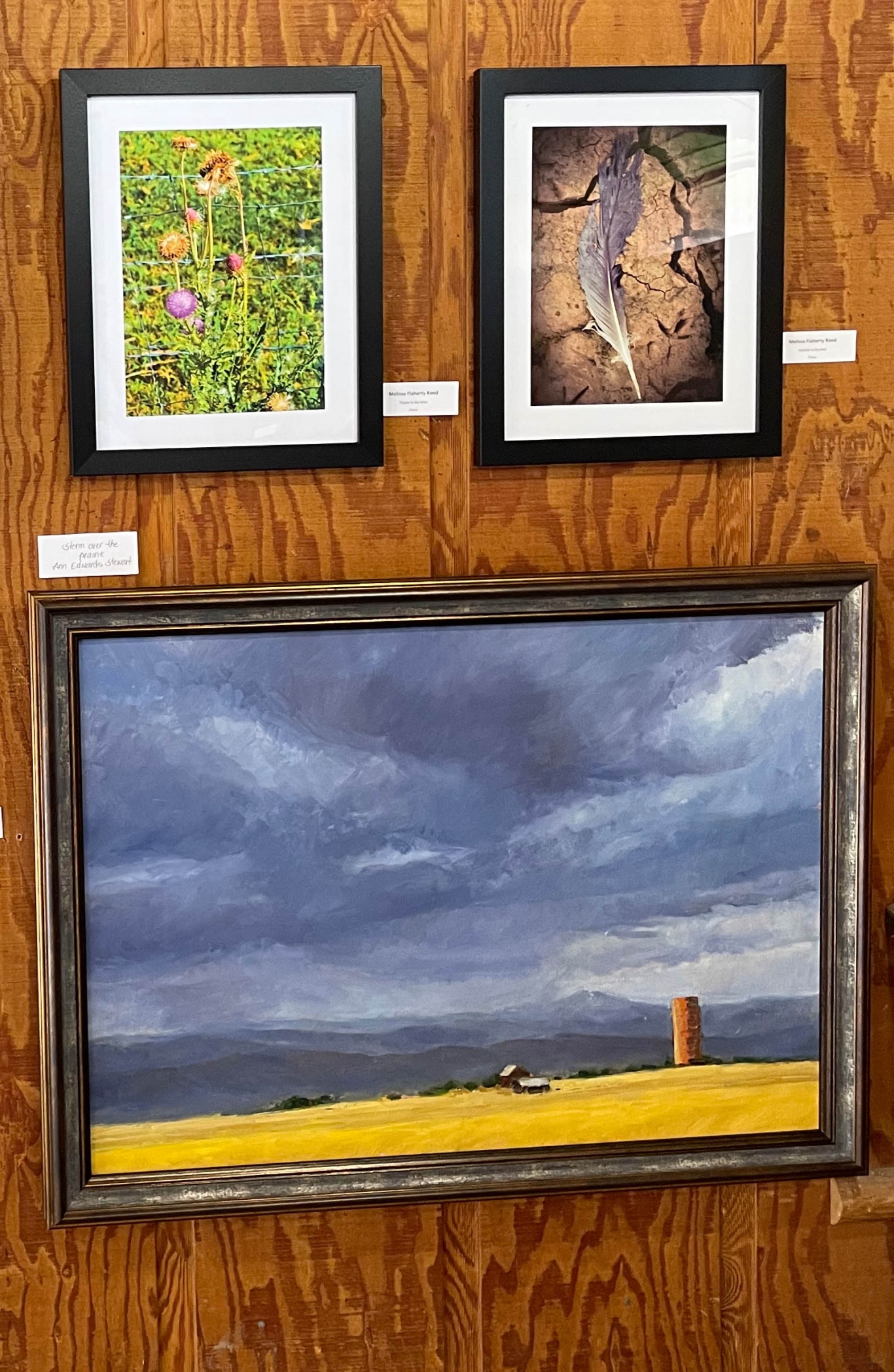 Three paintings on wall