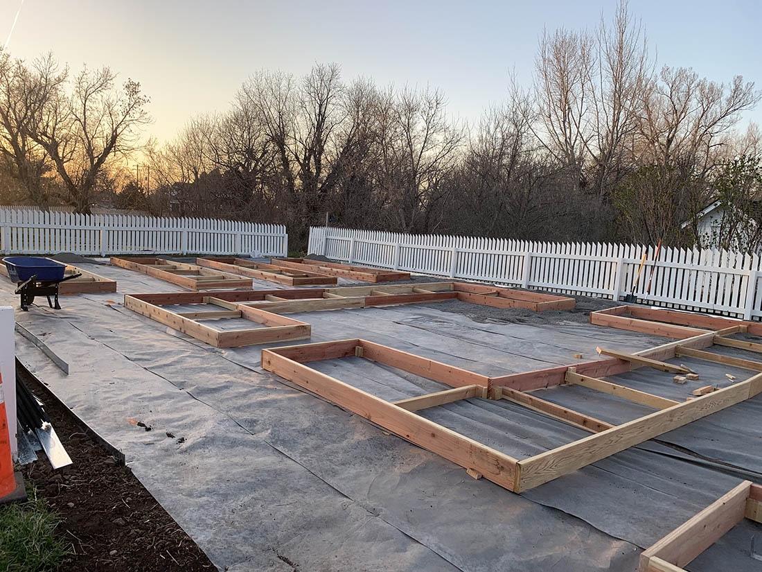 weedmatting with framed raised beds on top