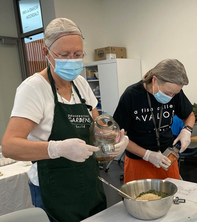 Guild members measuring ingredients