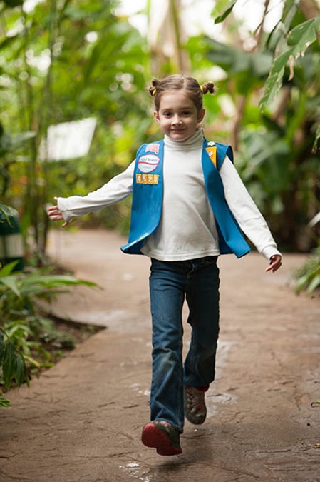 Girl Scout in conservatory