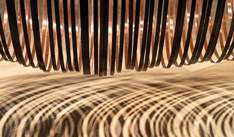 A sculpture made of steel bands and copper foil